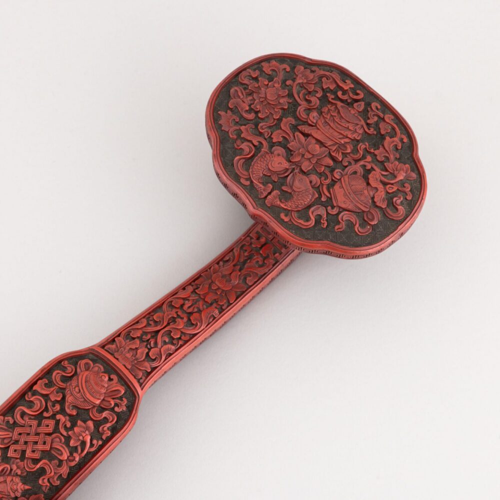 A cinnabar and black lacquer ‘ruyi’ sceptre (Qianlong period, 1735-1796)