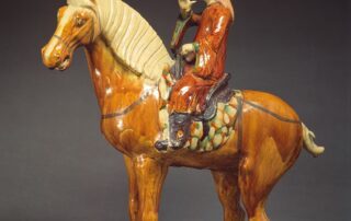 A ‘sancai’ pottery figure of an equestrian musician (Tang dynasty, 618-907 AD)
