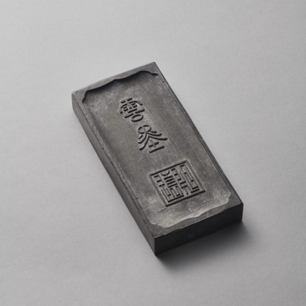 An inscribed ‘Hehe Erxian’ rectangular ink cake (Qianlong carved four-character mark and of the period, 1736-1795) - reverse