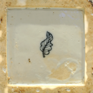 A blue and white square-form flask and cover (mark)
