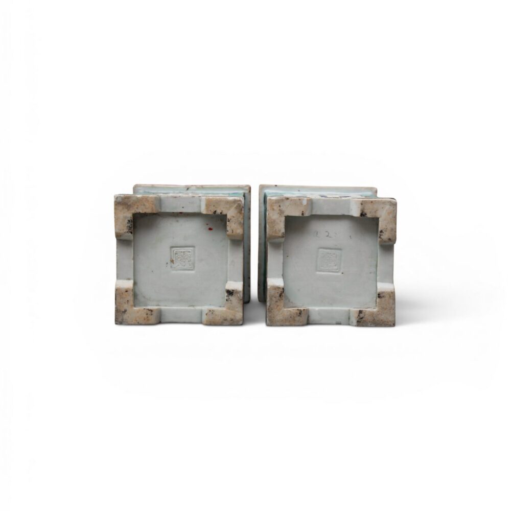 A pair of famille-verte biscuit-glazed openwork brushpots, ‘bitong’ (Kangxi period) (base)