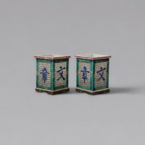 A pair of famille-verte biscuit-glazed openwork brushpots, ‘bitong’ (Kangxi period)