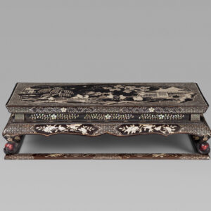 A finely carved black and red lacquer ‘Kang’ table with mother-of-pearl inlay