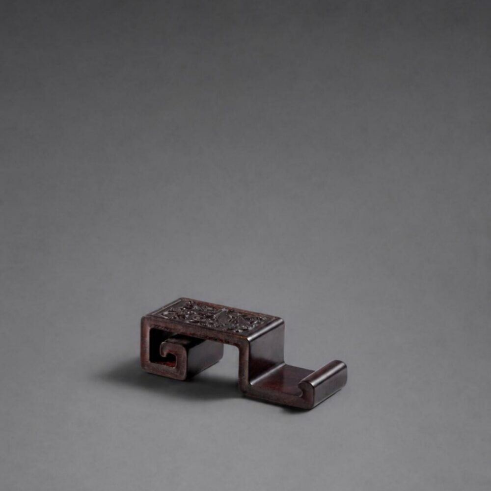 A zitan ‘chilong’ ink rest (Qing dynasty, 18th century)