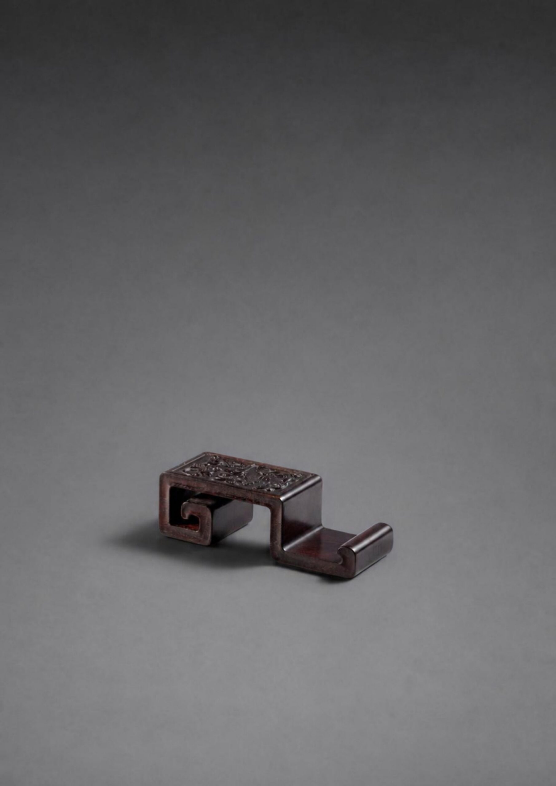 A zitan ‘chilong’ ink rest (Qing dynasty, 18th century)