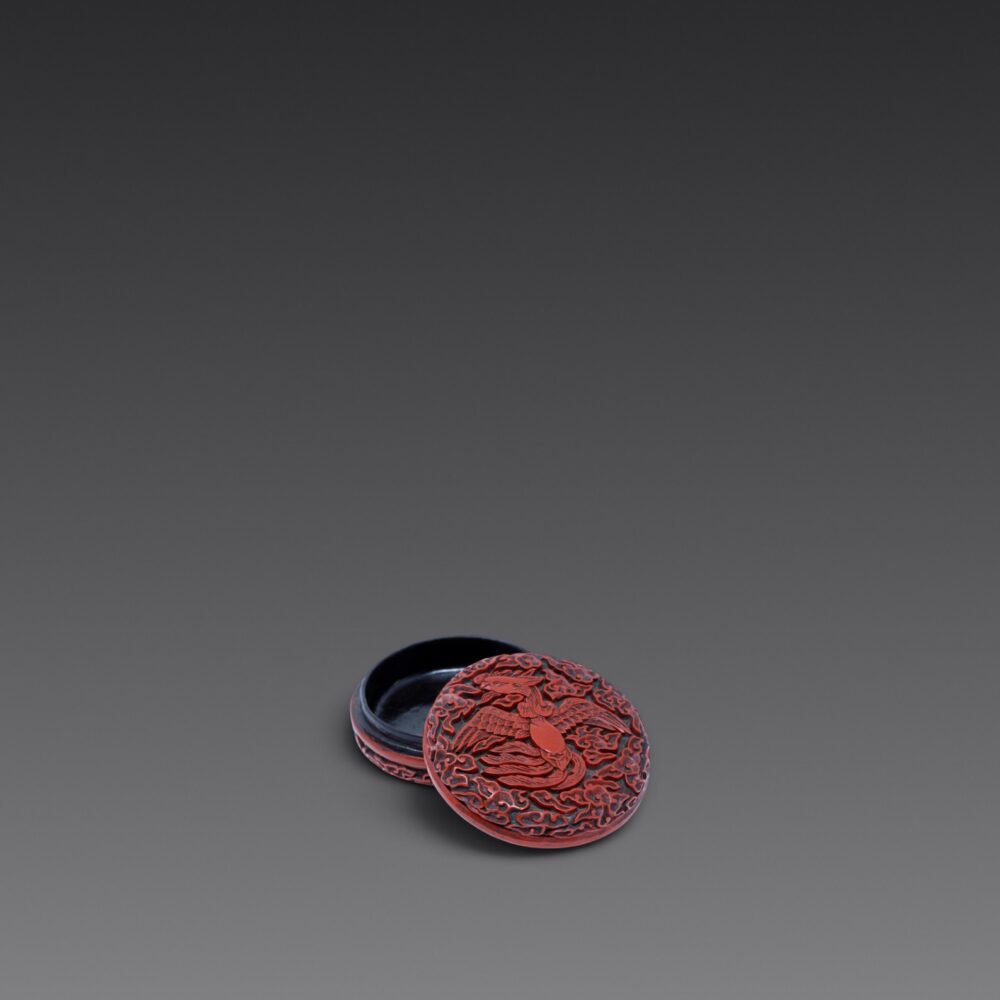 A carved cinnabar lacquer ‘phoenix’ box and cover (Yuan/Early Ming dynasty)