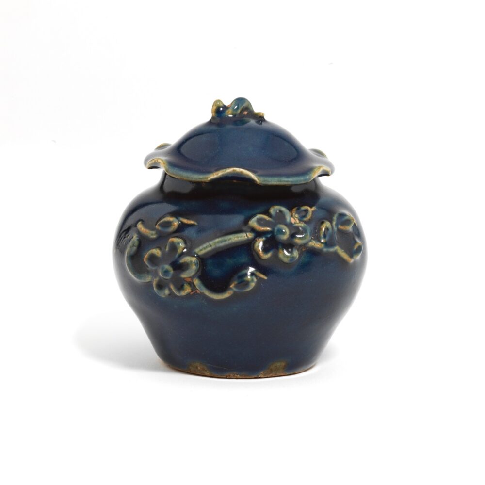 A small blue-glazed ‘flower and lotus’ jar and cover