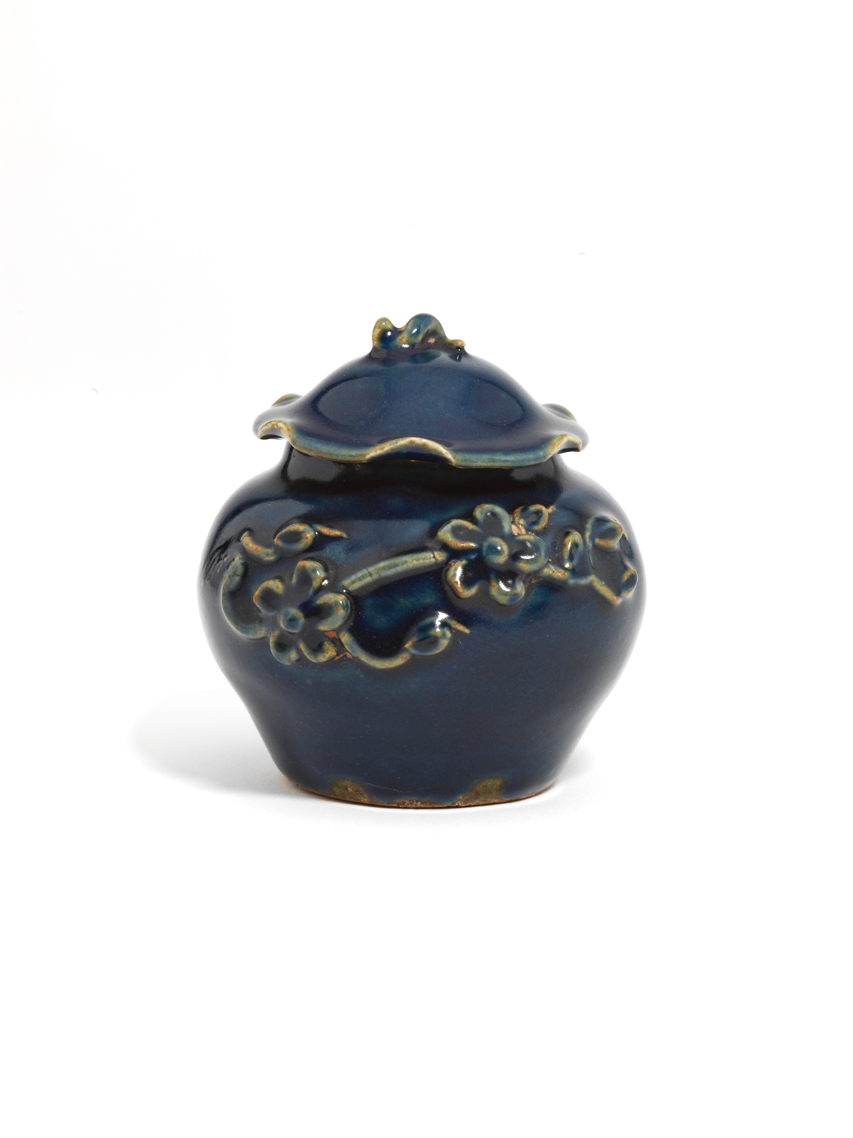 A small blue-glazed ‘flower and lotus’ jar and cover
