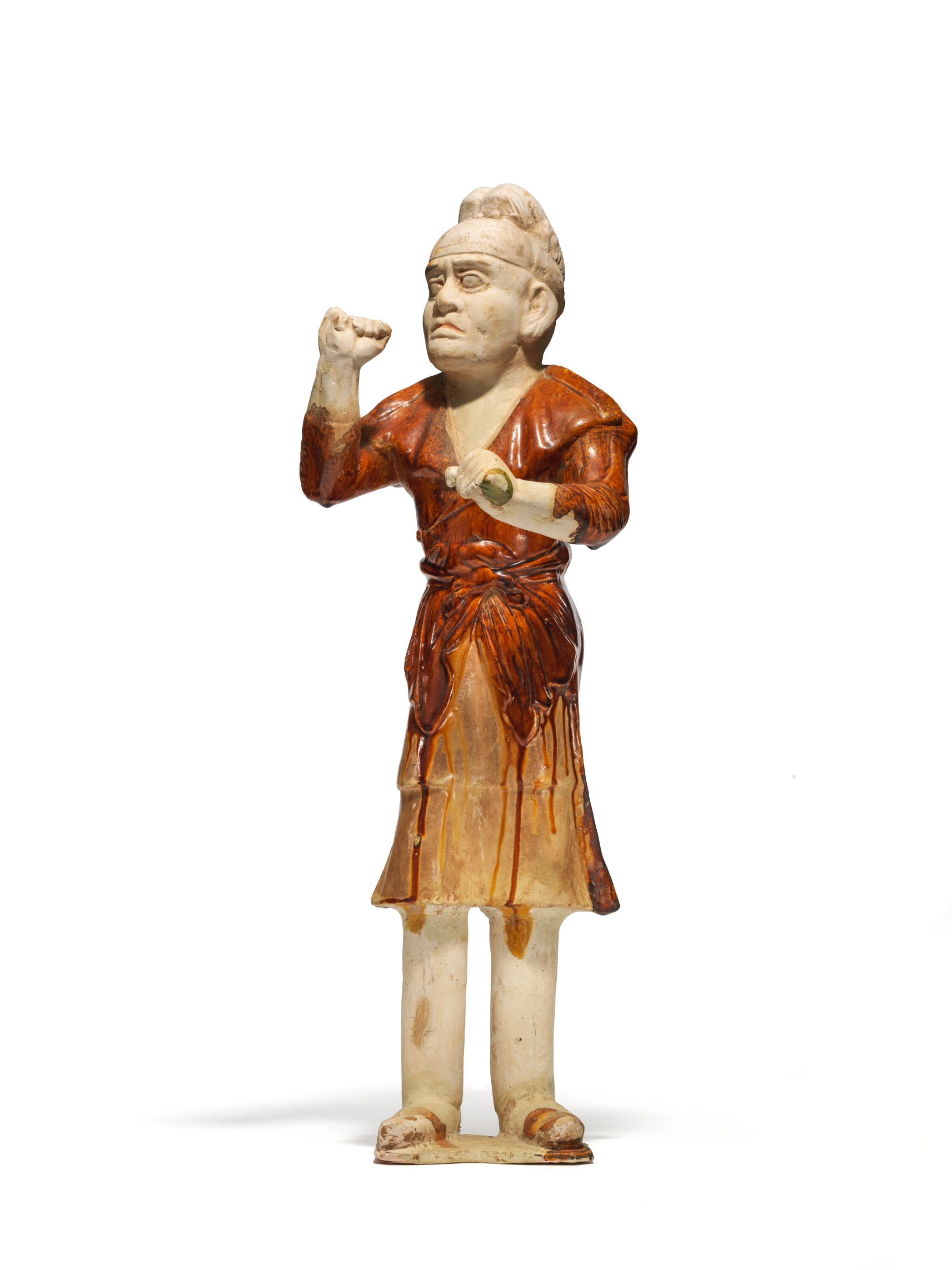 An amber and cream-glazed pottery figure of a groom